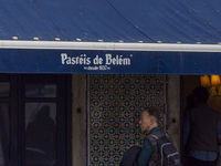 In Lisbon, Portugal, on December 1, 2024, a person waits in line to enter a pastry shop. Lisbon, the capital of Portugal, is one of Europe's...