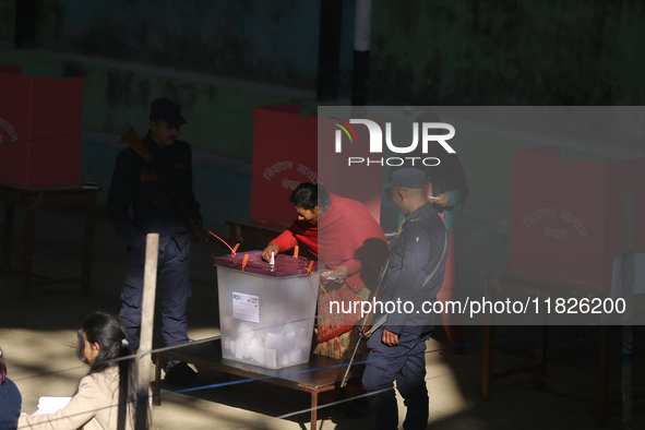 A Nepali voter casts a vote in the local by-election at a polling center in Kathmandu, Nepal, on December 1, 2024. A periodic election to el...