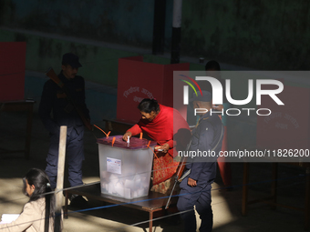 A Nepali voter casts a vote in the local by-election at a polling center in Kathmandu, Nepal, on December 1, 2024. A periodic election to el...