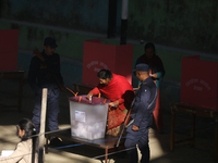 A Nepali voter casts a vote in the local by-election at a polling center in Kathmandu, Nepal, on December 1, 2024. A periodic election to el...