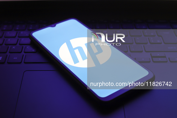 The HP Inc. logo appears on the screen of a smartphone in Reno, United States, on December 1, 2024. 