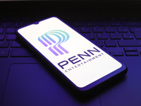 The PENN Entertainment logo appears on the screen of a smartphone in Reno, United States, on December 1, 2024. (