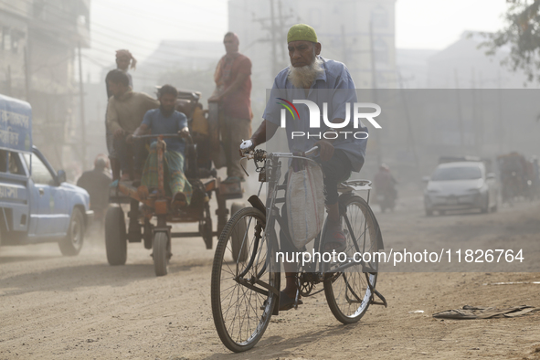 Residents make their way amid unhealthy air quality in Dhaka, Bangladesh, on December 1, 2024. 