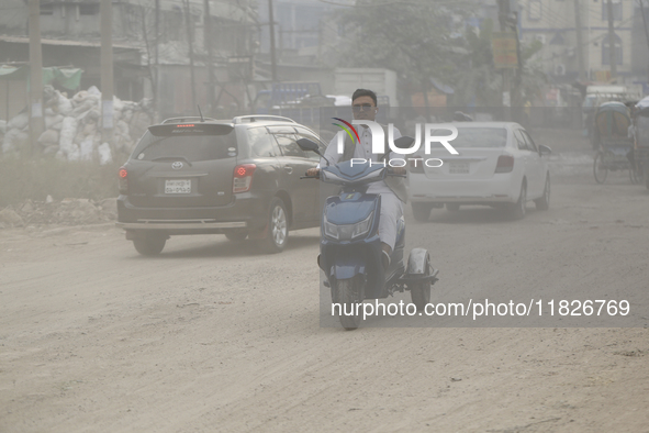 Residents make their way amid unhealthy air quality in Dhaka, Bangladesh, on December 1, 2024. 