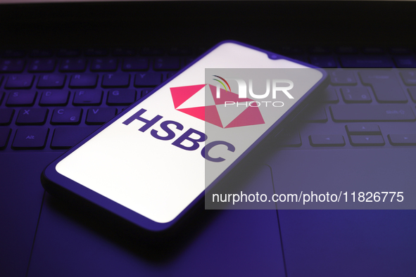 The HSBC logo appears on the screen of a smartphone in Reno, United States, on December 1, 2024. 