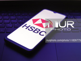 The HSBC logo appears on the screen of a smartphone in Reno, United States, on December 1, 2024. (