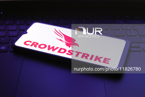 The CrowdStrike Holdings, Inc. logo appears on the screen of a smartphone in Reno, United States, on December 1, 2024. 