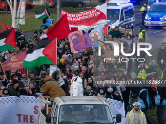 More than a hundred pro-Palestinian protesters take part in a demonstration against the German government's supply of arms to Israel in Colo...