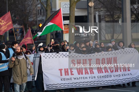 More than a hundred pro-Palestinian protesters take part in a demonstration against the German government's supply of arms to Israel in Colo...