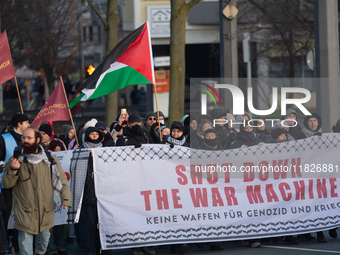 More than a hundred pro-Palestinian protesters take part in a demonstration against the German government's supply of arms to Israel in Colo...