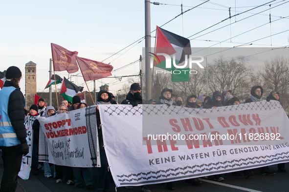 More than a hundred pro-Palestinian protesters take part in a demonstration against the German government's supply of arms to Israel in Colo...