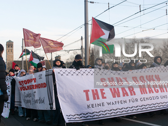 More than a hundred pro-Palestinian protesters take part in a demonstration against the German government's supply of arms to Israel in Colo...