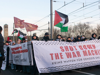 More than a hundred pro-Palestinian protesters take part in a demonstration against the German government's supply of arms to Israel in Colo...