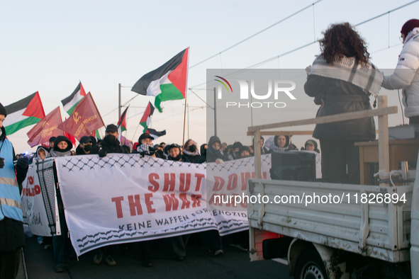 More than a hundred pro-Palestinian protesters take part in a demonstration against the German government's supply of arms to Israel in Colo...