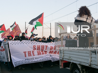 More than a hundred pro-Palestinian protesters take part in a demonstration against the German government's supply of arms to Israel in Colo...