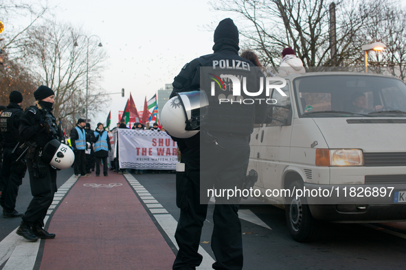 More than a hundred pro-Palestinian protesters take part in a demonstration against the German government's supply of arms to Israel in Colo...