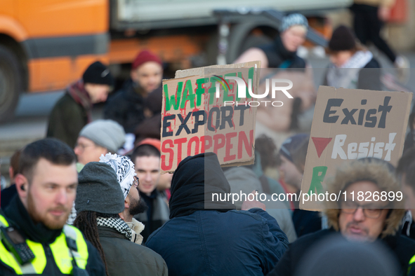 More than a hundred pro-Palestinian protesters take part in a demonstration against the German government's supply of arms to Israel in Colo...