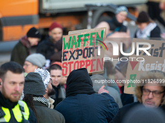 More than a hundred pro-Palestinian protesters take part in a demonstration against the German government's supply of arms to Israel in Colo...