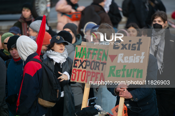 More than a hundred pro-Palestinian protesters take part in a demonstration against the German government's supply of arms to Israel in Colo...