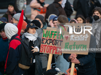 More than a hundred pro-Palestinian protesters take part in a demonstration against the German government's supply of arms to Israel in Colo...