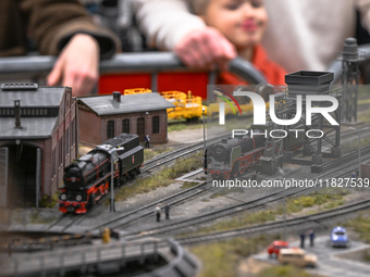 KRAKOW, POLAND - DECEMBER 01: 
Train enthusiasts and hobbyists gather at the Nowa Huta Cultural Center, where a 700 m2 space becomes a capti...