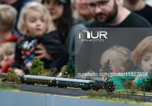 KRAKOW, POLAND - DECEMBER 01: 
Train enthusiasts and hobbyists gather at the Nowa Huta Cultural Center, where a 700 m2 space becomes a capti...