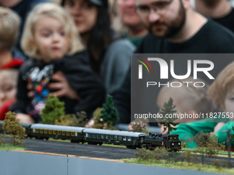 KRAKOW, POLAND - DECEMBER 01: 
Train enthusiasts and hobbyists gather at the Nowa Huta Cultural Center, where a 700 m2 space becomes a capti...