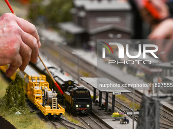 KRAKOW, POLAND - DECEMBER 01: 
Train enthusiasts and hobbyists gather at the Nowa Huta Cultural Center, where a 700 m2 space becomes a capti...