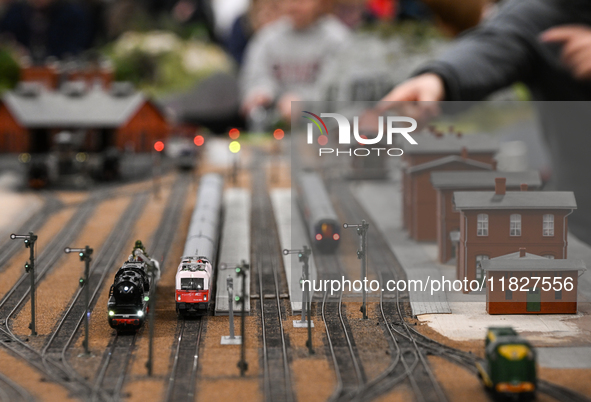 KRAKOW, POLAND - DECEMBER 01: 
Train enthusiasts and hobbyists gather at the Nowa Huta Cultural Center, where a 700 m2 space becomes a capti...