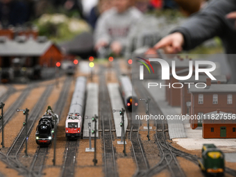 KRAKOW, POLAND - DECEMBER 01: 
Train enthusiasts and hobbyists gather at the Nowa Huta Cultural Center, where a 700 m2 space becomes a capti...