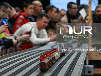 KRAKOW, POLAND - DECEMBER 01: 
Train enthusiasts and hobbyists gather at the Nowa Huta Cultural Center, where a 700 m2 space becomes a capti...