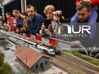 KRAKOW, POLAND - DECEMBER 01: 
Train enthusiasts and hobbyists gather at the Nowa Huta Cultural Center, where a 700 m2 space becomes a capti...