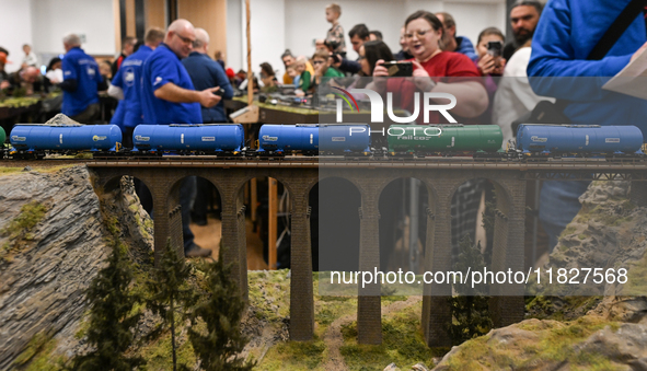 KRAKOW, POLAND - DECEMBER 01: 
Train enthusiasts and hobbyists gather at the Nowa Huta Cultural Center, where a 700 m2 space becomes a capti...