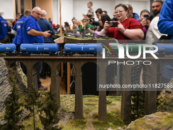 KRAKOW, POLAND - DECEMBER 01: 
Train enthusiasts and hobbyists gather at the Nowa Huta Cultural Center, where a 700 m2 space becomes a capti...