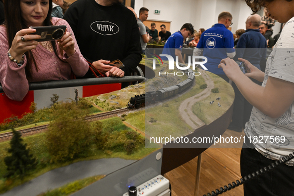 KRAKOW, POLAND - DECEMBER 01: 
Train enthusiasts and hobbyists gather at the Nowa Huta Cultural Center, where a 700 m2 space becomes a capti...