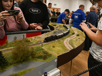 KRAKOW, POLAND - DECEMBER 01: 
Train enthusiasts and hobbyists gather at the Nowa Huta Cultural Center, where a 700 m2 space becomes a capti...