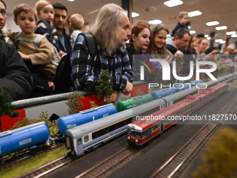 KRAKOW, POLAND - DECEMBER 01: 
Train enthusiasts and hobbyists gather at the Nowa Huta Cultural Center, where a 700 m2 space becomes a capti...