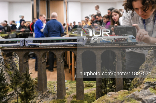 KRAKOW, POLAND - DECEMBER 01: 
Train enthusiasts and hobbyists gather at the Nowa Huta Cultural Center, where a 700 m2 space becomes a capti...