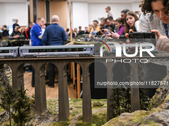 KRAKOW, POLAND - DECEMBER 01: 
Train enthusiasts and hobbyists gather at the Nowa Huta Cultural Center, where a 700 m2 space becomes a capti...