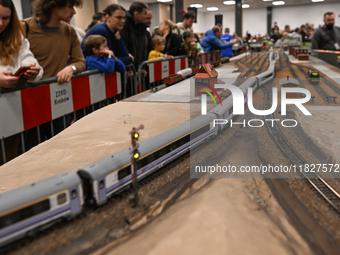 KRAKOW, POLAND - DECEMBER 01: 
Train enthusiasts and hobbyists gather at the Nowa Huta Cultural Center, where a 700 m2 space becomes a capti...