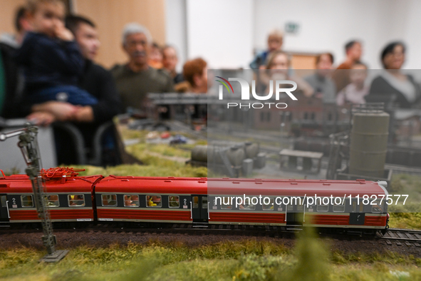 KRAKOW, POLAND - DECEMBER 01: 
Train enthusiasts and hobbyists gather at the Nowa Huta Cultural Center, where a 700 m2 space becomes a capti...