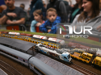 KRAKOW, POLAND - DECEMBER 01: 
Train enthusiasts and hobbyists gather at the Nowa Huta Cultural Center, where a 700 m2 space becomes a capti...