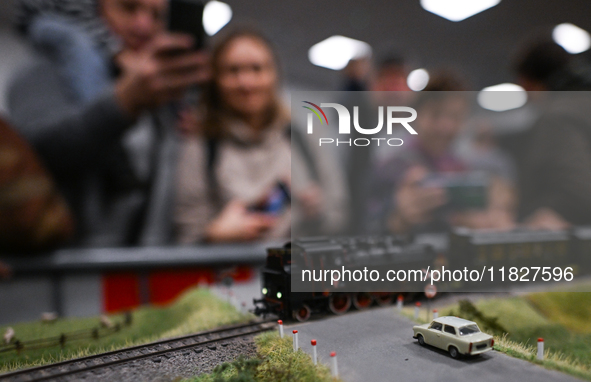 KRAKOW, POLAND - DECEMBER 01: 
Train enthusiasts and hobbyists gather at the Nowa Huta Cultural Center, where a 700 m2 space becomes a capti...