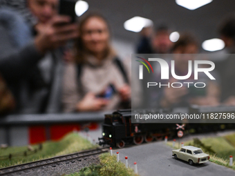 KRAKOW, POLAND - DECEMBER 01: 
Train enthusiasts and hobbyists gather at the Nowa Huta Cultural Center, where a 700 m2 space becomes a capti...