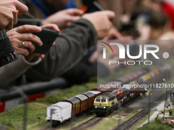 KRAKOW, POLAND - DECEMBER 01: 
Train enthusiasts and hobbyists gather at the Nowa Huta Cultural Center, where a 700 m2 space becomes a capti...