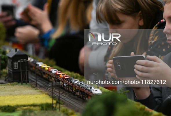 KRAKOW, POLAND - DECEMBER 01: 
Train enthusiasts and hobbyists gather at the Nowa Huta Cultural Center, where a 700 m2 space becomes a capti...