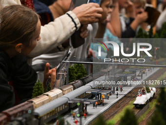 KRAKOW, POLAND - DECEMBER 01: 
Train enthusiasts and hobbyists gather at the Nowa Huta Cultural Center, where a 700 m2 space becomes a capti...