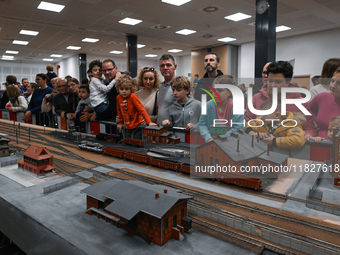 KRAKOW, POLAND - DECEMBER 01: 
Train enthusiasts and hobbyists gather at the Nowa Huta Cultural Center, where a 700 m2 space becomes a capti...