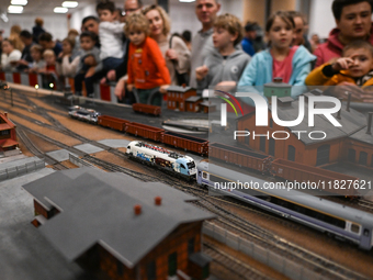 KRAKOW, POLAND - DECEMBER 01: 
Train enthusiasts and hobbyists gather at the Nowa Huta Cultural Center, where a 700 m2 space becomes a capti...