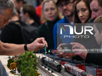 KRAKOW, POLAND - DECEMBER 01: 
Train enthusiasts and hobbyists gather at the Nowa Huta Cultural Center, where a 700 m2 space becomes a capti...